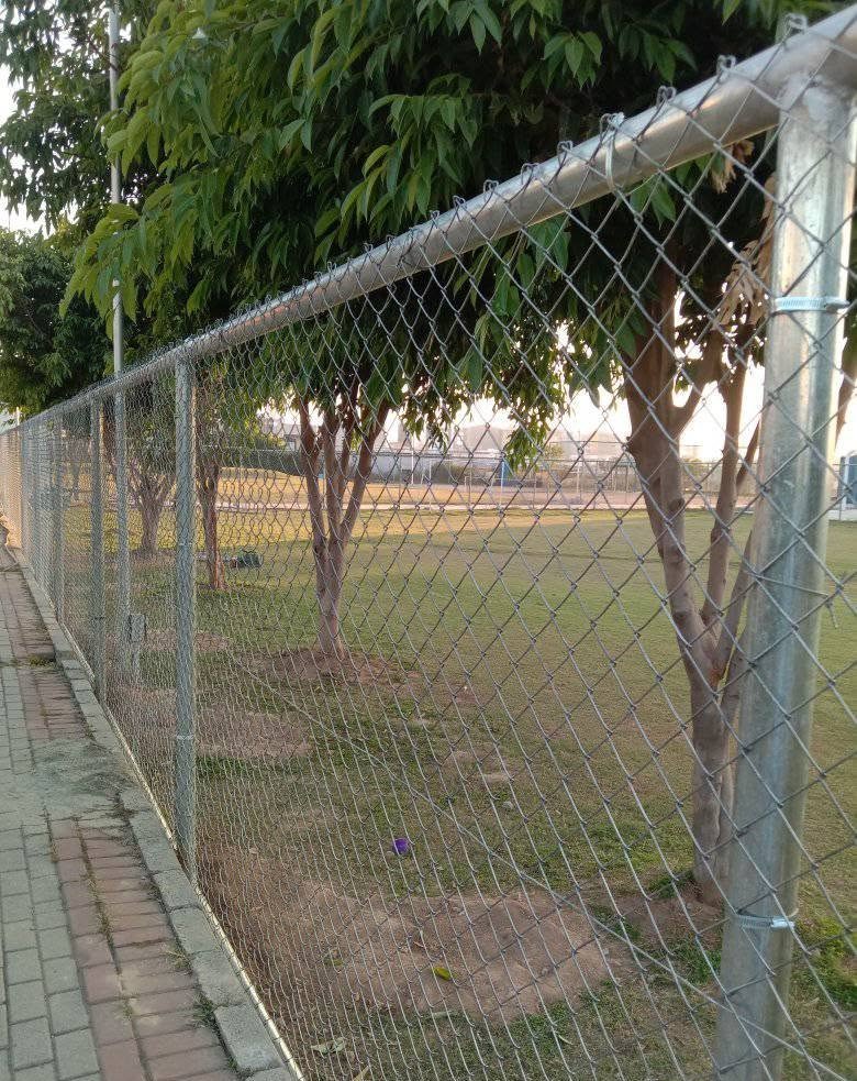 School and sports ground fencing supporting photo