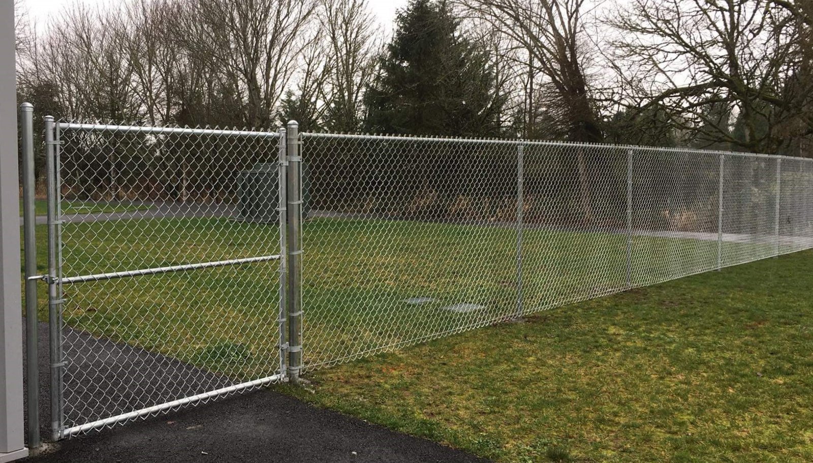 Installed chain link fencing along a property boundary